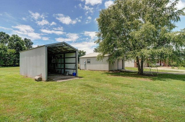 14521 Lawrence Unit 2145, Mount Vernon, MO 65712 - view of grassy yard with an outbuilding, an outdoor structure, and a carport