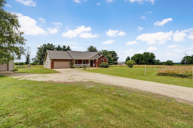 14521 Lawrence Unit 2145, Mount Vernon, MO 65712 - view of front facade with driveway, an attached garage, and a front lawn