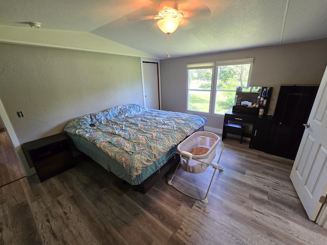 4662 S 30th Rd, Fair Play, MO 65649 - bedroom featuring wood finished floors, lofted ceiling, a textured ceiling, and ceiling fan