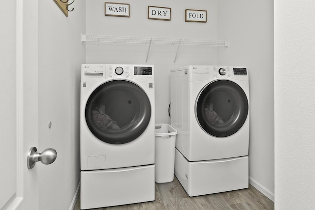 237 Kelsi Ln, Branson, MO 65616 - laundry room with washer and dryer and wood finished floors