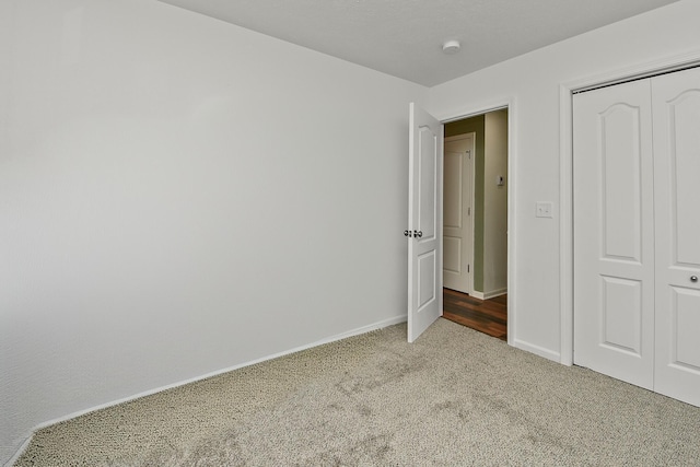 237 Kelsi Ln, Branson, MO 65616 - unfurnished bedroom featuring carpet floors and a closet