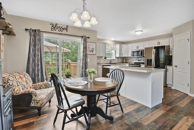237 Kelsi Ln, Branson, MO 65616 - dining space with a chandelier and dark wood finished floors