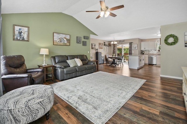 237 Kelsi Ln, Branson, MO 65616 - living area featuring a ceiling fan, vaulted ceiling, dark wood-style floors, and a chandelier