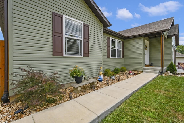 237 Kelsi Ln, Branson, MO 65616 - entrance to property featuring roof with shingles and a yard