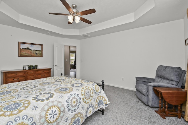 237 Kelsi Ln, Branson, MO 65616 - carpeted bedroom featuring a tray ceiling and ceiling fan