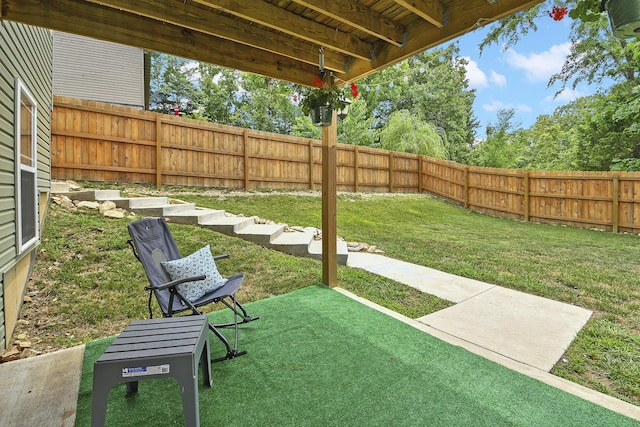 237 Kelsi Ln, Branson, MO 65616 - fenced backyard featuring a patio area