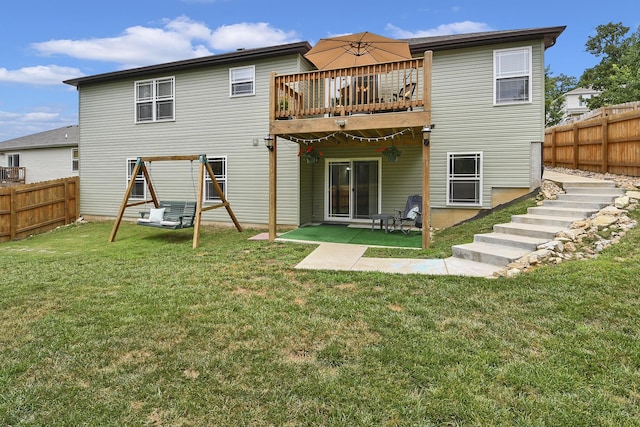 237 Kelsi Ln, Branson, MO 65616 - rear view of property featuring a fenced backyard, a deck, and a patio