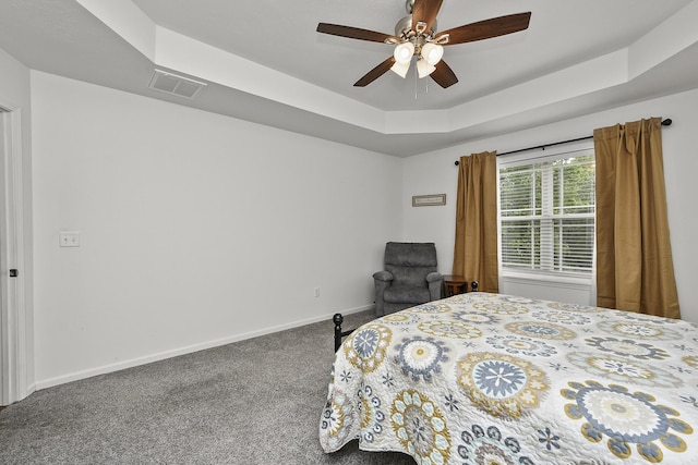 237 Kelsi Ln, Branson, MO 65616 - carpeted bedroom with a tray ceiling and a ceiling fan