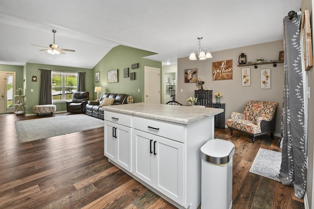 237 Kelsi Ln, Branson, MO 65616 - kitchen with a ceiling fan, lofted ceiling, white cabinets, dark wood-style floors, and a chandelier