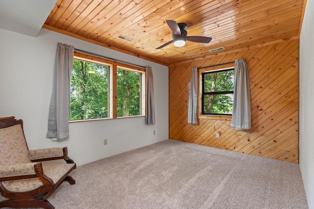 537 Watson Rd, Branson, MO 65616 - unfurnished room featuring carpet flooring, wooden walls, wood ceiling, and a ceiling fan