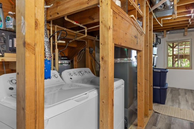 537 Watson Rd, Branson, MO 65616 - laundry area with washer and clothes dryer and wood finished floors