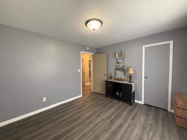 212 W Lindberg St, Springfield, MO 65807 - bedroom featuring wood finished floors and baseboards