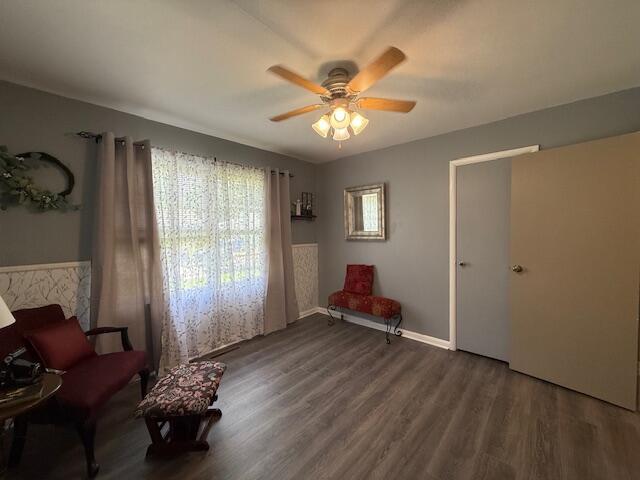 212 W Lindberg St, Springfield, MO 65807 - living area with wood finished floors and a ceiling fan