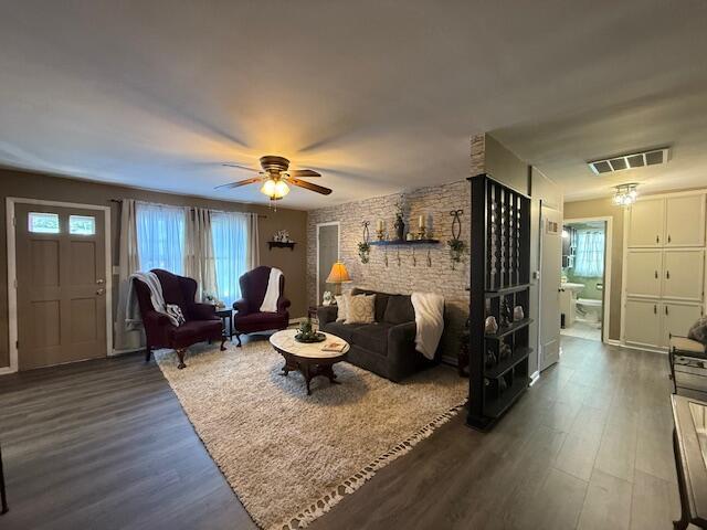 212 W Lindberg St, Springfield, MO 65807 - living room with dark wood finished floors and a ceiling fan
