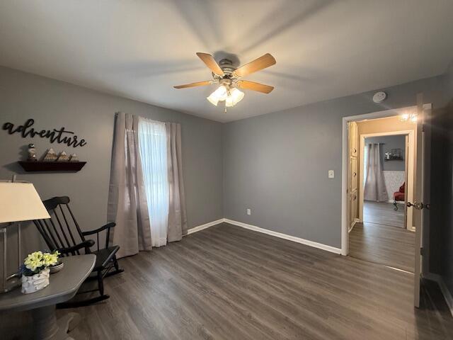 212 W Lindberg St, Springfield, MO 65807 - unfurnished room featuring a ceiling fan and dark wood-style flooring