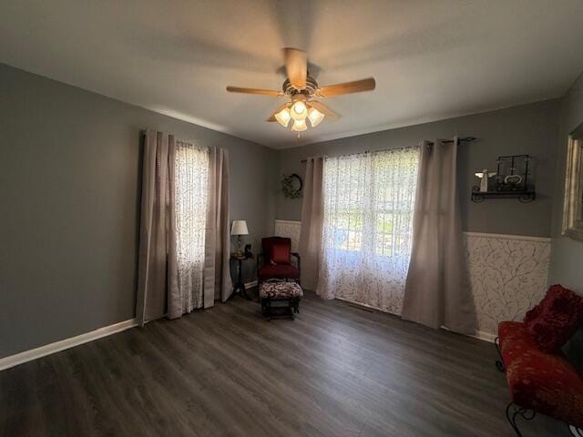 212 W Lindberg St, Springfield, MO 65807 - living area featuring healthy amount of natural light, wood finished floors, and a ceiling fan