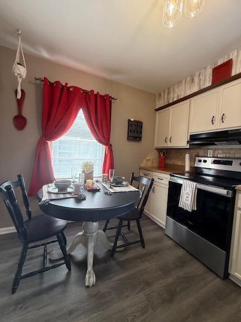 212 W Lindberg St, Springfield, MO 65807 - dining space with dark wood-style flooring