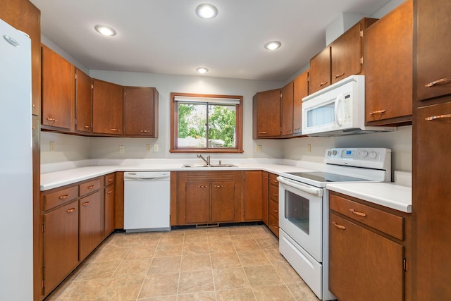 6 Maple Ct, Branson, MO 65616 - kitchen featuring white appliances, light countertops, brown cabinets, and recessed lighting