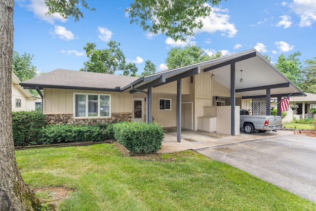 6 Maple Ct, Branson, MO 65616 - ranch-style house featuring a carport, a front lawn, concrete driveway, stone siding, and a shingled roof