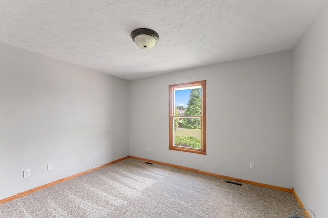 2155 W Vincent St, Springfield, MO 65810 - empty room with carpet flooring and a textured ceiling