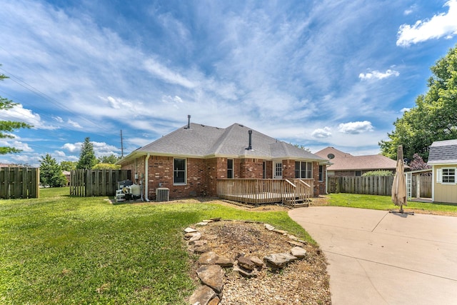 2155 W Vincent St, Springfield, MO 65810 - view of front of house featuring a deck, brick siding, a patio, and an outbuilding
