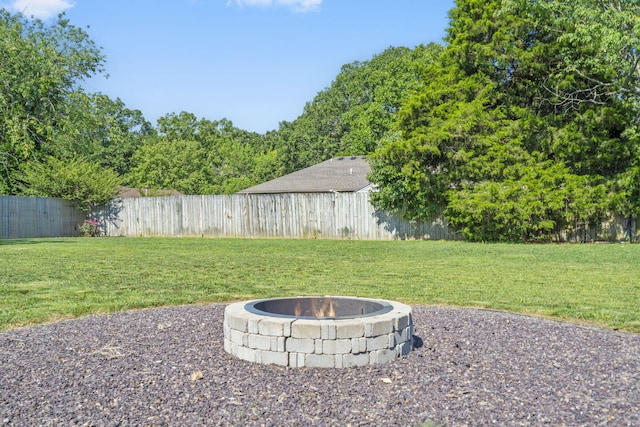 724 N Vermillion Dr, Strafford, MO 65757 - fenced backyard with an outdoor fire pit