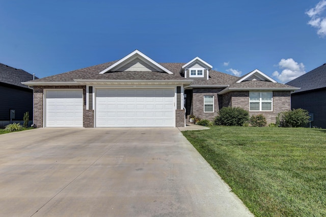 677 N Fox Hill Cir, Nixa, MO 65714 - view of front of house with concrete driveway, brick siding, a front lawn, and an attached garage