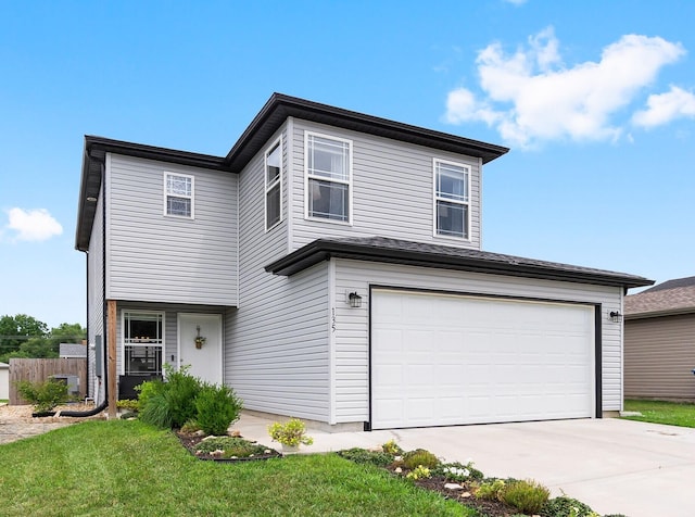 135 Pin Oak Ct, Hollister, MO 65672 - traditional-style house featuring concrete driveway, an attached garage, and a front yard