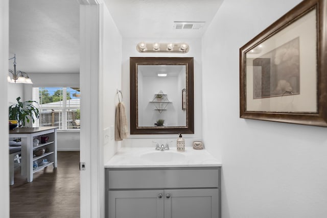 135 Pin Oak Ct, Hollister, MO 65672 - bathroom with vanity and wood finished floors