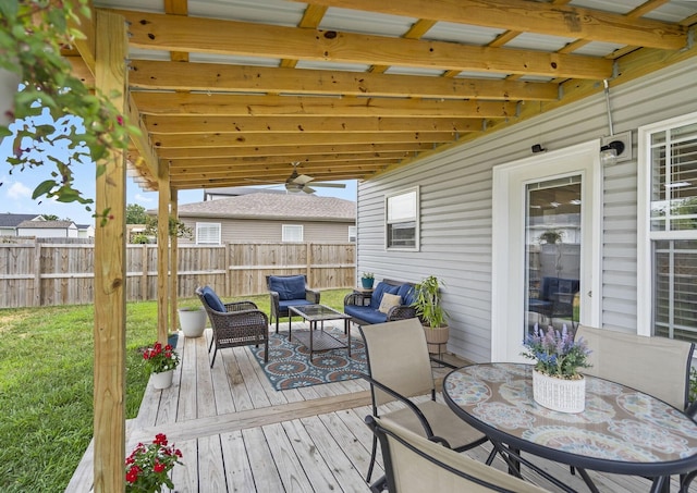 135 Pin Oak Ct, Hollister, MO 65672 - wooden terrace with a fenced backyard, an outdoor hangout area, and a ceiling fan