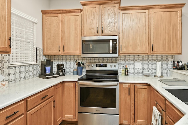 1376 N Sandy Creek Cir # 1, Nixa, MO 65714 - kitchen with stainless steel appliances, backsplash, and light countertops