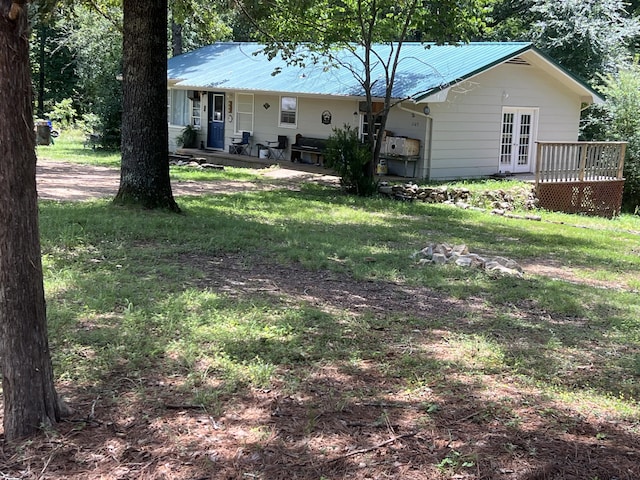 1103 Riverview Dr, Mammoth Spring, AR 72554 - back of house with a metal roof, a porch, a yard, and french doors