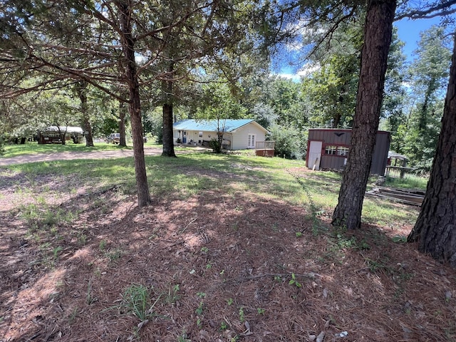 1103 Riverview Dr, Mammoth Spring, AR 72554 - view of yard featuring a storage shed and view of scattered trees