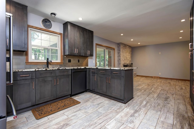 2210 S Catalina Ave, Springfield, MO 65804 - kitchen featuring dishwasher, a peninsula, light wood-style floors, recessed lighting, and tasteful backsplash