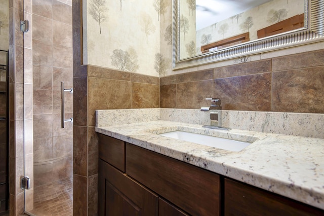 2210 S Catalina Ave, Springfield, MO 65804 - bathroom with vanity, a shower stall, and tile walls