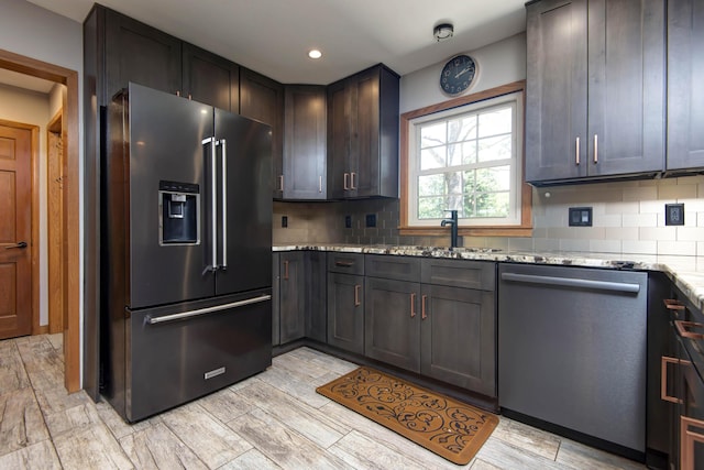 2210 S Catalina Ave, Springfield, MO 65804 - kitchen featuring high end refrigerator, dishwasher, decorative backsplash, light stone counters, and recessed lighting