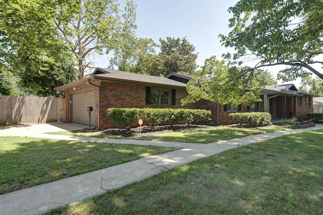 2210 S Catalina Ave, Springfield, MO 65804 - view of front of home with brick siding, a garage, and concrete driveway