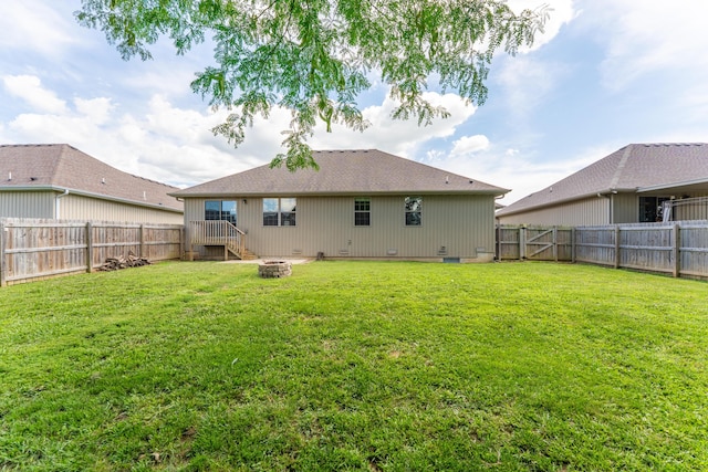 865 E Striper Dr, Nixa, MO 65714 - rear view of house with a fire pit, a fenced backyard, and crawl space