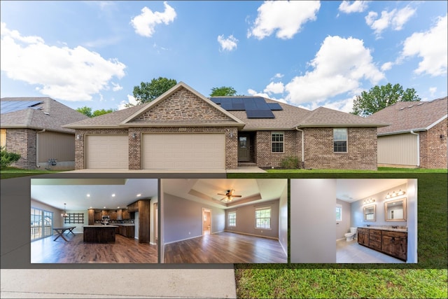 865 E Striper Dr, Nixa, MO 65714 - view of front of home with solar panels, brick siding, roof with shingles, and a garage