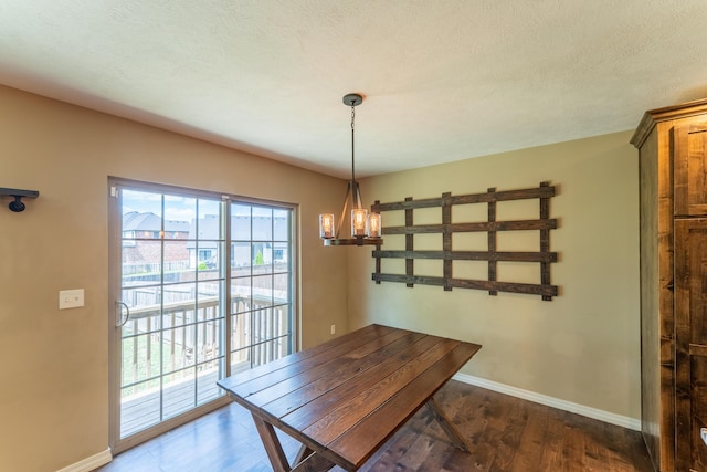 865 E Striper Dr, Nixa, MO 65714 - unfurnished dining area featuring dark wood-style floors and a chandelier