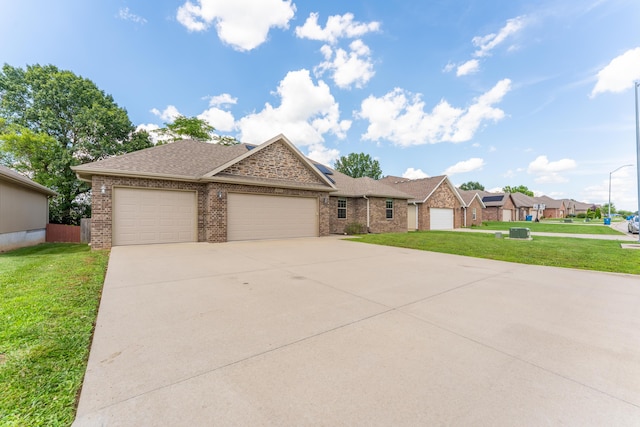 865 E Striper Dr, Nixa, MO 65714 - view of front of home featuring a garage, brick siding, concrete driveway, a front lawn, and roof with shingles