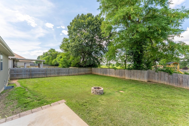 865 E Striper Dr, Nixa, MO 65714 - fenced backyard featuring an outdoor fire pit