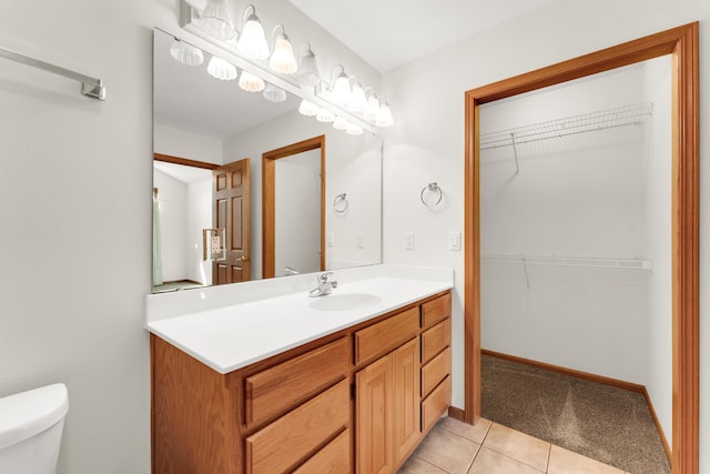 201 Silver Oak Ln, Branson West, MO 65737 - bathroom with vanity, tile patterned floors, and a walk in closet