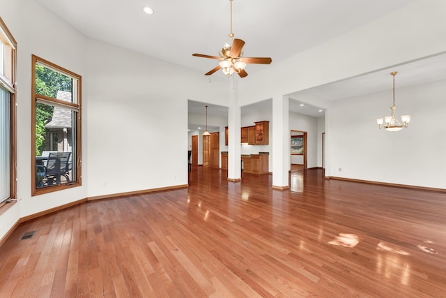 201 Silver Oak Ln, Branson West, MO 65737 - unfurnished living room featuring light wood finished floors, ceiling fan, a chandelier, and recessed lighting