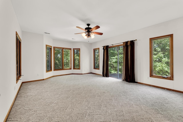 201 Silver Oak Ln, Branson West, MO 65737 - carpeted empty room with plenty of natural light and a ceiling fan