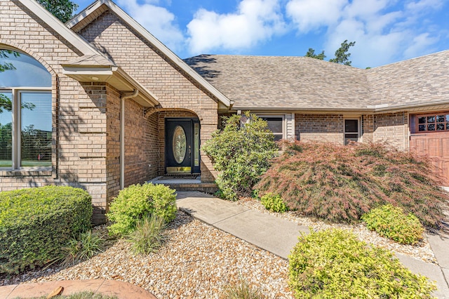 201 Silver Oak Ln, Branson West, MO 65737 - doorway to property featuring brick siding and a shingled roof