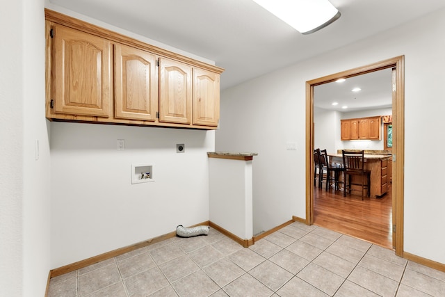 201 Silver Oak Ln, Branson West, MO 65737 - washroom featuring electric dryer hookup, cabinet space, recessed lighting, washer hookup, and light tile patterned floors