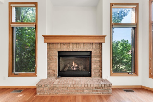 201 Silver Oak Ln, Branson West, MO 65737 - detailed view of wood finished floors and a fireplace