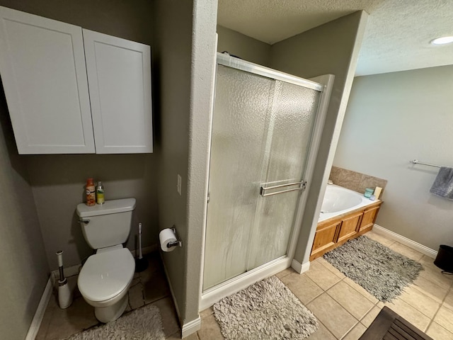 5537 S Pinehurst Ave, Springfield, MO 65810 - full bath featuring a shower stall, a garden tub, tile patterned floors, and a textured ceiling