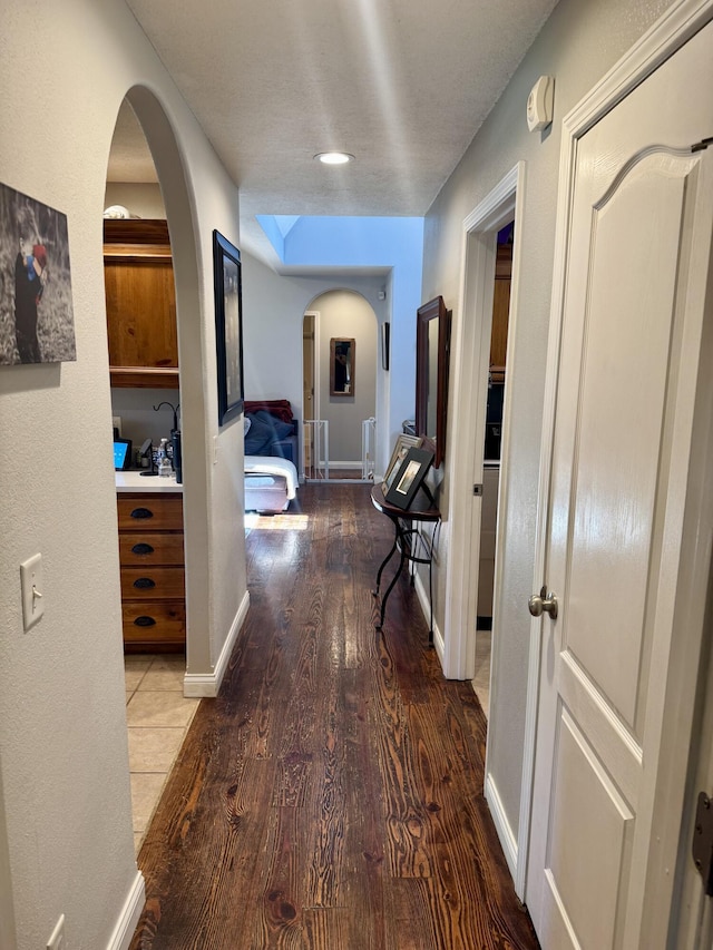 5537 S Pinehurst Ave, Springfield, MO 65810 - hallway with wood finished floors and arched walkways